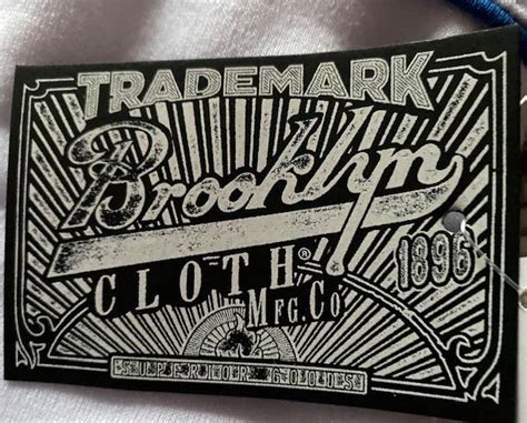 What is Trademark Clothing Trademark clothing is when the designer's name or fashion company is inextricably linked to the clothing itself. . Trademark brooklyn cloth